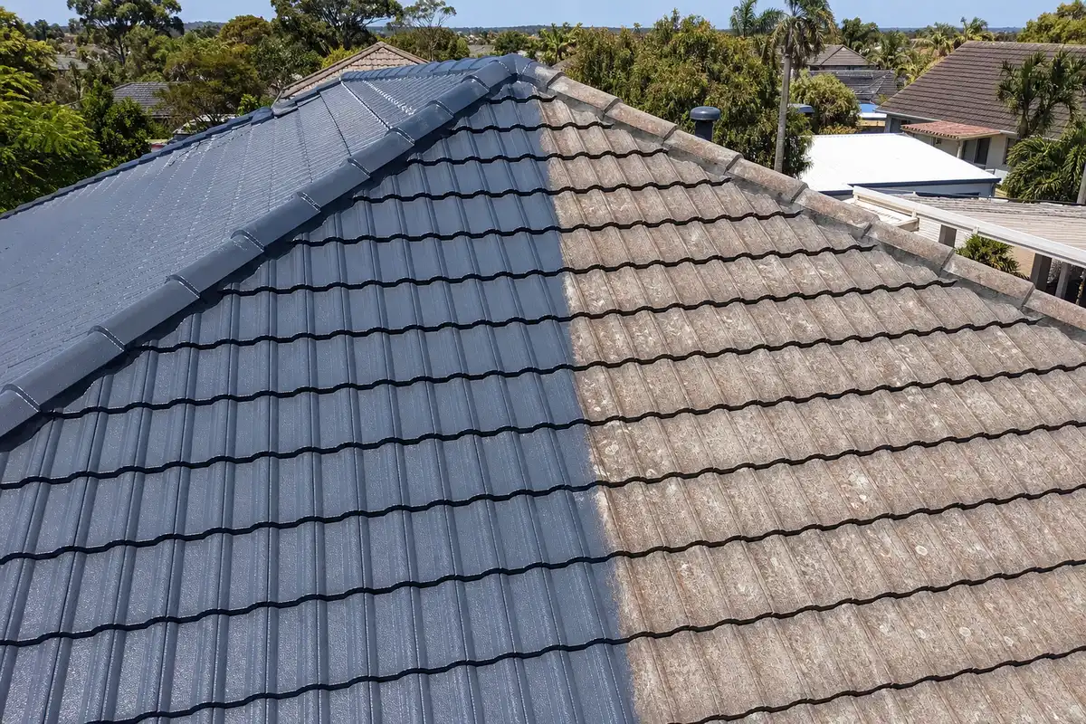 A Central Coast tile roof half freshly restored and half faded and weathered, shot from roof level