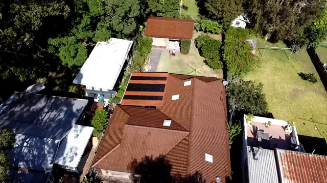 The same Pearl Beach tile roof after restoration, recoated in a chocolate colour