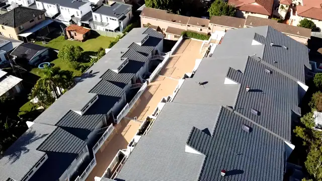 Aerial view of a Terrigal unit complex with its tile roofs restored in Woodland Grey