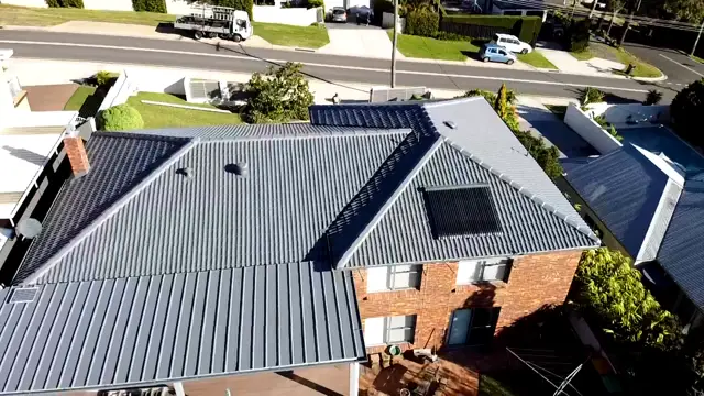 Aerial view of a restored Basalt tile roof on a two storey brick home in Wamberal