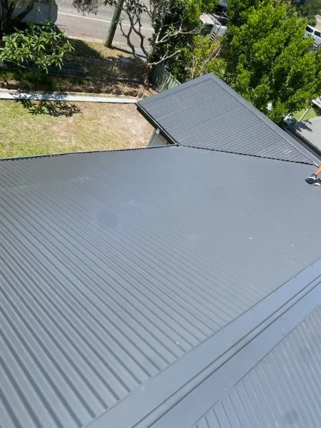 Freshly installed charcoal metal roof, aerial view — Roof Restorations & Replacements Central Coast
